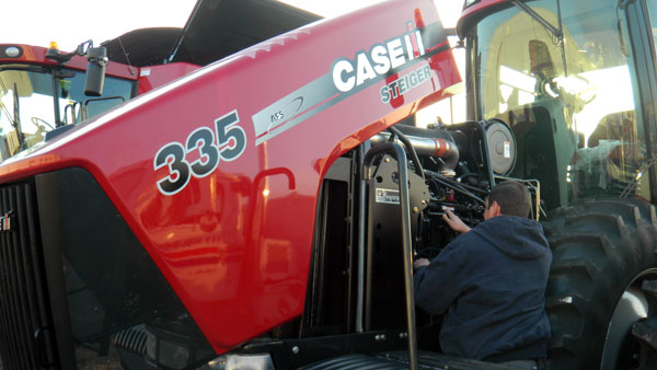 Man working on Steiger 335 - WE OFFER THE POWER TO GET YOU MORE.