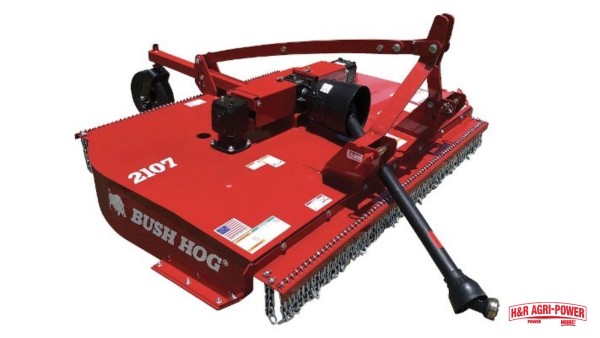 Bush Hog 2107 rotary cutter with PTO shaft and chain guards on a white background.