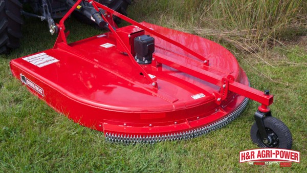 Red Bush Hog rotary cutter deck with chain guards for heavy brush and trail maintenance