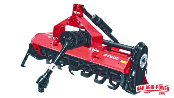 Bush Hog rotary tiller with PTO driveline and heavy-duty tines for larger field preparation
