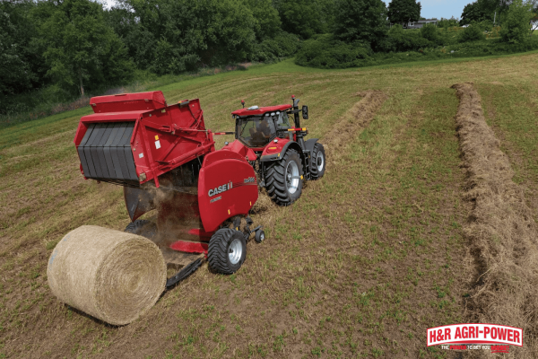 Case IH tractor with baler producing round hay bales, highlighting essential features for mixed farming operations
