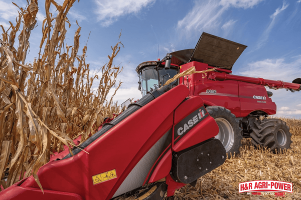 Close-up of Case IH combine header harvesting corn, showcasing peak performance through proper maintenance