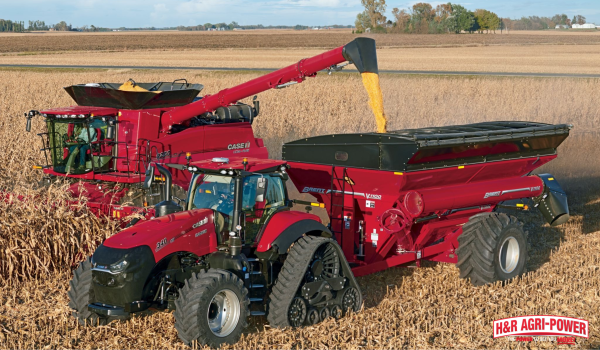 Case IH combine unloading corn into a grain cart during harvest for farm equipment financing planning