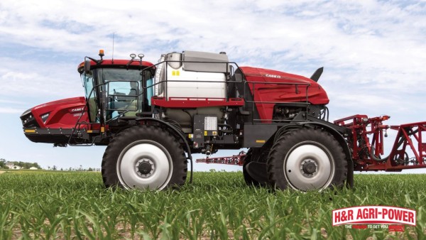 Case IH Patriot sprayer moving through row crops with precision field guidance technology
