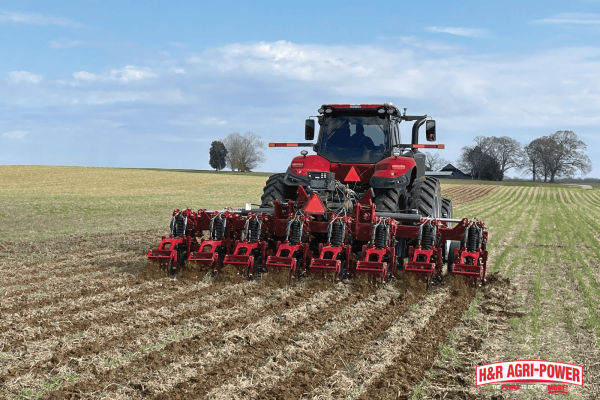 Case IH tractor operating a tillage implement across a field, demonstrating improved efficiency with the right farm equipment
