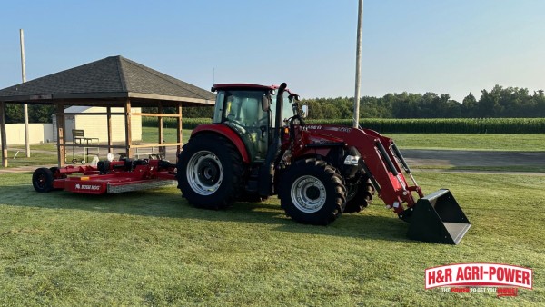 Case IH tractor pulling a Bush Hog rotary cutter for field maintenance and implement inspection