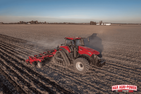 Case IH tractor working in a field, representing a seasonal maintenance plan for tractors in Mississippi conditions