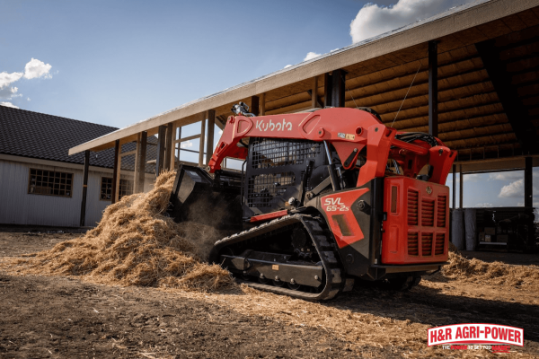 Kubota compact track loader operating in a confined job site, demonstrating maneuverability in tight or rural spaces