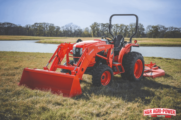 Kubota tractor with mower attachment demonstrating fuel-efficient operation in a field