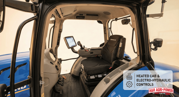 Interior of New Holland loader cab with ergonomic seat and control interface.