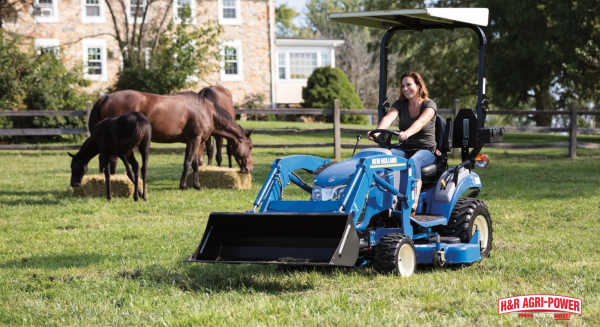 New Holland compact tractor with front loader used for pasture and horse property maintenance