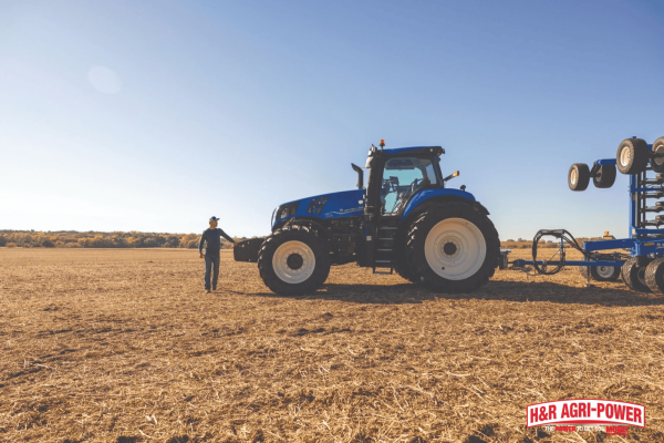 New Holland tractor with operator in field, emphasizing cabin care to prevent mold and mildew in humid climates