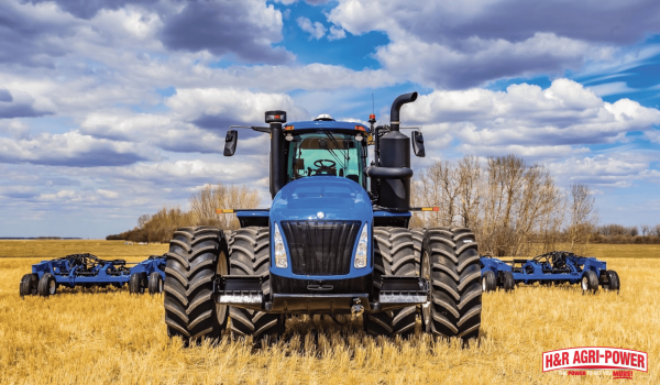 New Holland tractor in field with tillage equipment representing successful tractor ownership