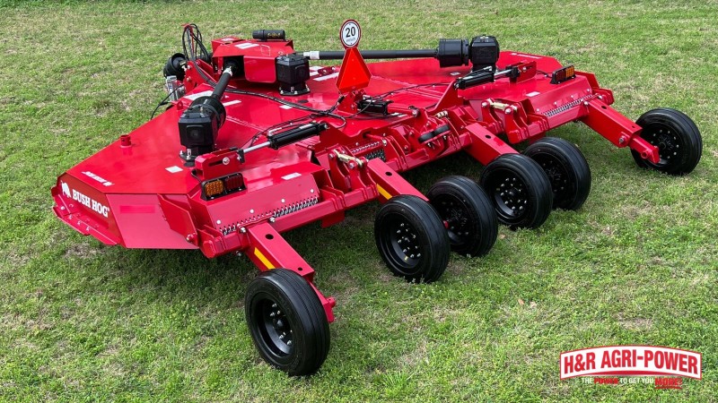 red bush hog rotary cutter grassy field