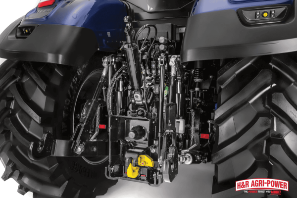 Close-up of tractor rear linkage and hydraulic system, highlighting safety checks before performing maintenance