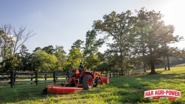 Tractor operating a rotary cutter near a fence line for safe food plot maintenance