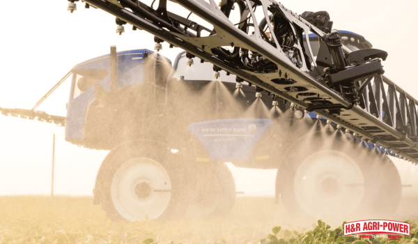 tractors parked in snowy field showing outdoor winter equipment storage conditions