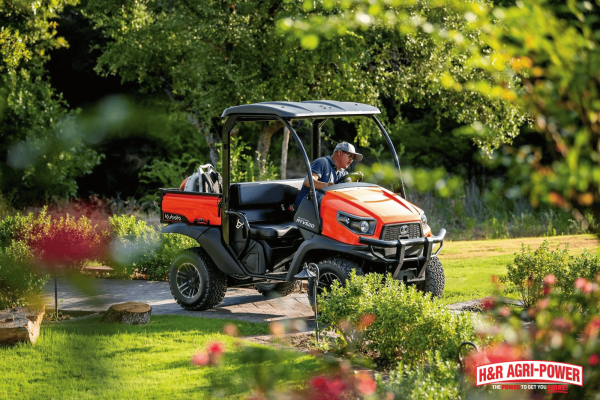 Kubota RTV utility vehicle equipped with roll-over protection system demonstrating safety features in a work environment